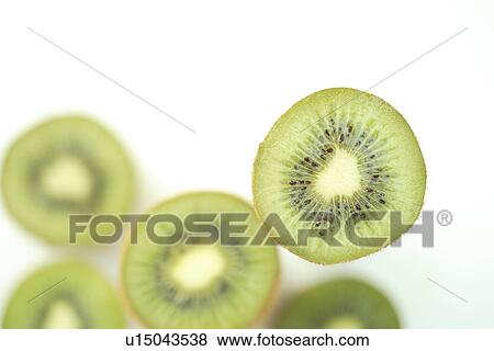 Sliced Kiwi fruits View Large Photo Image Stock Photo - Sliced Kiwi fruits. Fotosearch