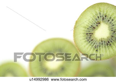Stock Photograph - Sliced Kiwi fruits. Fotosearch