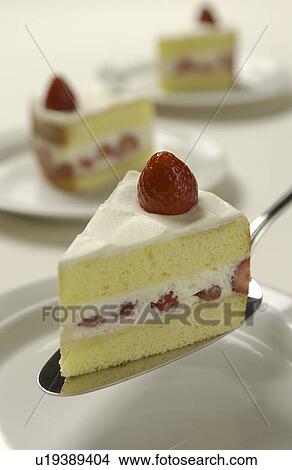 Picture - Sliced strawberry cake on server, white background. Fotosearch