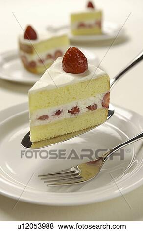 Stock Photo - Sliced strawberry cake on server, white background. Fotosearch