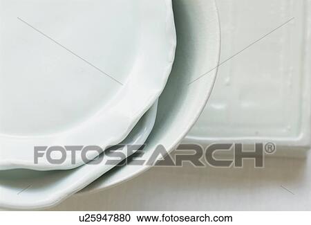 Stock Image - Stacked ceramic plates. Fotosearch