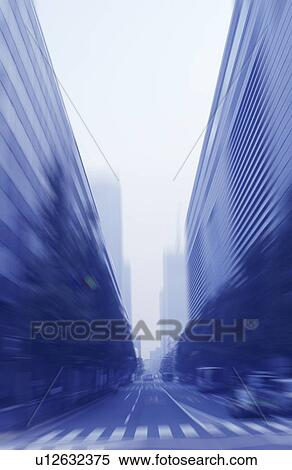 Stock Photography - Street in city, toned image, blurred motion. Fotosearch