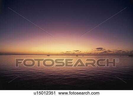 Stock Image - Sunset Sky Over the Sea. Fotosearch