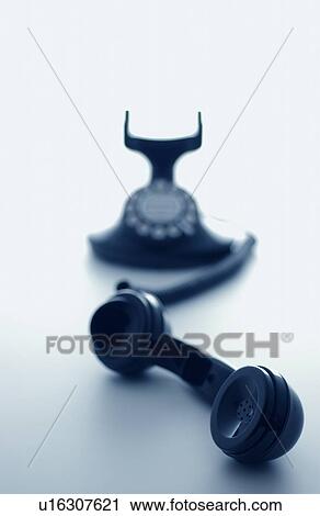 Stock Image - Telephone receiver, white background. Fotosearch