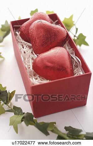Stock Photo - Three Red Heart Chocolates in Box. Fotosearch