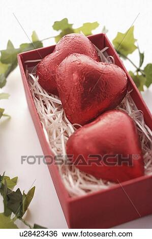 Three Red Heart Chocolates in Box View Large Photo Image Stock Photograph - Three Red Heart Chocolates in Box. Fotosearch