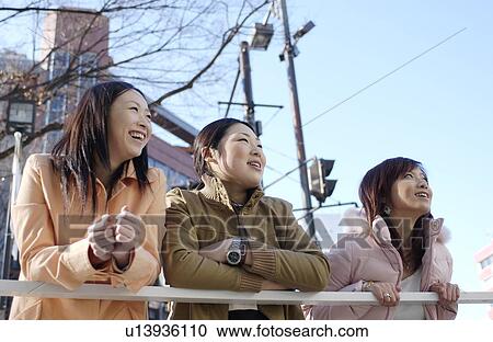 Three young women on footbridge, Tokyo Prefecture, Honshu, Japan View Large Photo Image Stock Image - Three young women on footbridge, Tokyo Prefecture, Honshu, Japan. Fotosearch