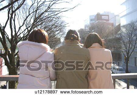 Three young women on footbridge, Tokyo Prefecture, Honshu, Japan View Large Photo Image Stock Photo - Three young women on footbridge, Tokyo Prefecture, Honshu, Japan. Fotosearch