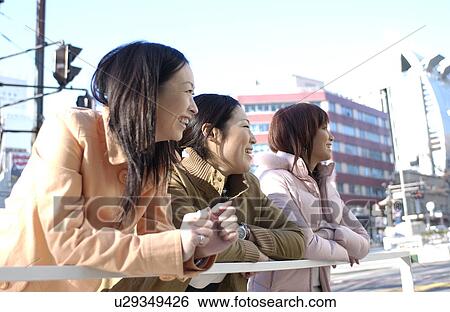 Three young women on footbridge, Tokyo Prefecture, Honshu, Japan View Large Photo Image Stock Photograph - Three young women on footbridge, Tokyo Prefecture, Honshu, Japan. Fotosearch