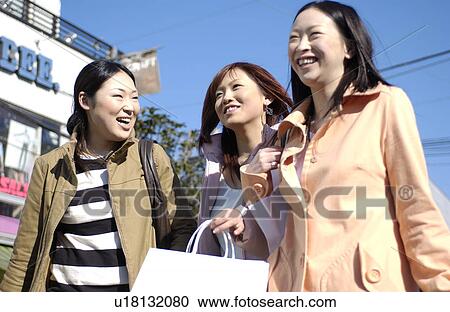 Three young women with shopping bags View Large Photo Image Stock Image - Three young women with shopping bags. Fotosearch
