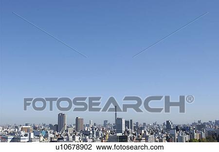 Stock Image - Tokyo cityscape under sky, copy space, Tokyo prefecture, Japan. Fotosearch