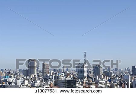 Stock Image - Tokyo cityscape under sky, copy space, Tokyo prefecture, Japan. Fotosearch