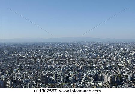 Stock Photo - Tokyo cityscape under sky, copy space, Tokyo prefecture, Japan. Fotosearch