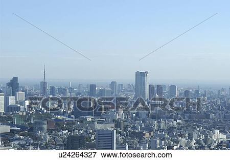 Stock Photo - Tokyo cityscape under sky, copy space, Tokyo prefecture, Japan. Fotosearch