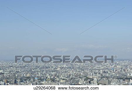 Stock Photo - Tokyo cityscape under sky, copy space, Tokyo prefecture, Japan. Fotosearch