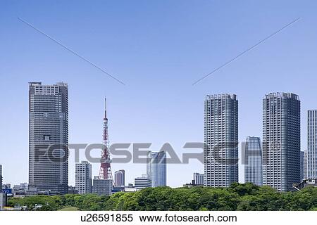 Stock Photography - Tokyo Tower and high rise buildings under sky, copy space, Tokyo prefecture, Japan. Fotosearch
