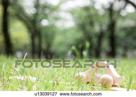 Stock Photo - Toy car on grass, close up, differential focus. Fotosearch