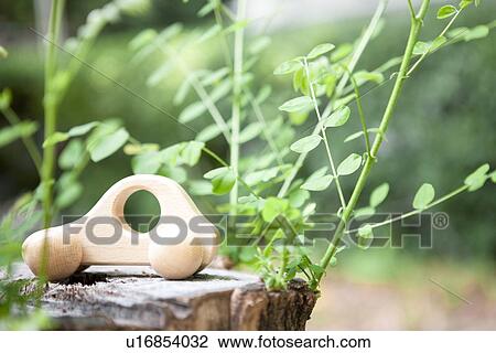 Toy car on tree stump, close up View Large Photo Image Stock Image - Toy car on tree stump, close up. Fotosearch