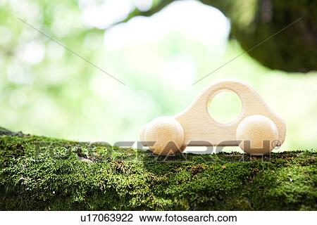 Toy car on tree trunk, close up, differential focus View Large Photo Image Stock Image - Toy car on tree trunk, close up, differential focus. Fotosearch