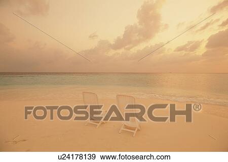 Stock Photo - Two Beach Chairs on Beach. Fotosearch