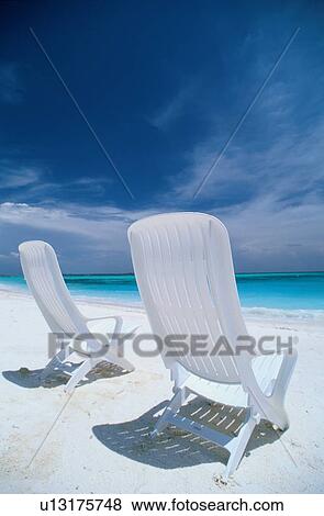 Two deck chairs on beach View Large Photo Image Stock Photo - Two deck chairs on beach. Fotosearch
