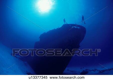 Two divers exploring ship wreck, Micronesia View Large Photo Image Stock Photography - Two divers exploring ship wreck, Micronesia. Fotosearch