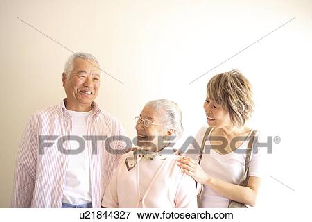 Two generation family, smiling, white background View Large Photo Image Stock Photo - Two generation family, smiling, white background. Fotosearch