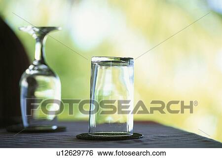 Stock Photograph - Two glasses on table. Fotosearch