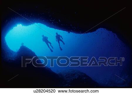 Stock Image - Two scuba divers underwater. Fotosearch