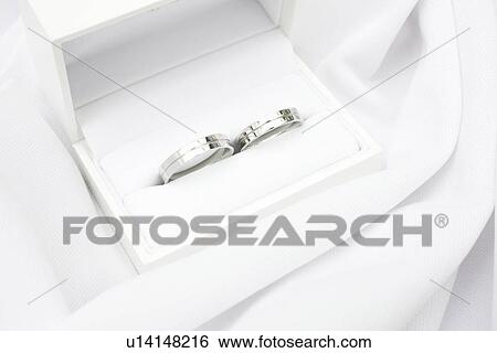 Wedding rings in a box View Large Photo Image Stock Photograph - Wedding rings in a box. Fotosearch