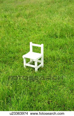 Picture - White chair in field, Hayama town, Kanagawa prefecture, Japan. Fotosearch