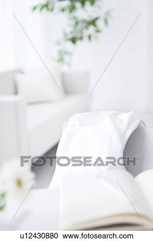 Stock Image - White shirt on chair. Fotosearch