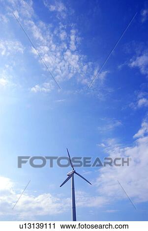 Stock Image - Wind turbine under sky, copy space, Miura city, Kanagawa prefecture, Japan. Fotosearch