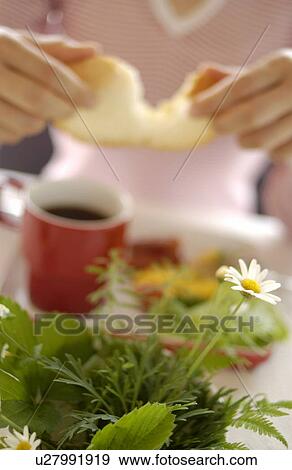 Stock Photo - Woman Eating Breakfast. Fotosearch