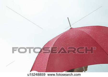 Woman under red umbrella, white background View Large Photo Image Stock Photo - Woman under red umbrella, white background. Fotosearch