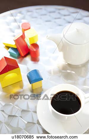 Wooden blocks and cup of coffee on table View Large Photo Image Stock Photography - Wooden blocks and cup of coffee on table. Fotosearch