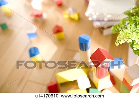 Stock Image - Wooden blocks on floor, differential focus. Fotosearch
