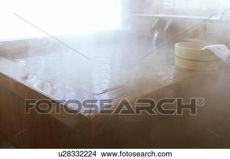 Picture - Wooden bucket on bathtub. Fotosearch