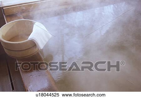 Stock Photography - Wooden bucket on bathtub. Fotosearch