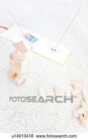 Stock Photo - Wooden building blocks and sketch pad. Fotosearch