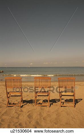 Picture - Wooden Chairs on Beach. Fotosearch