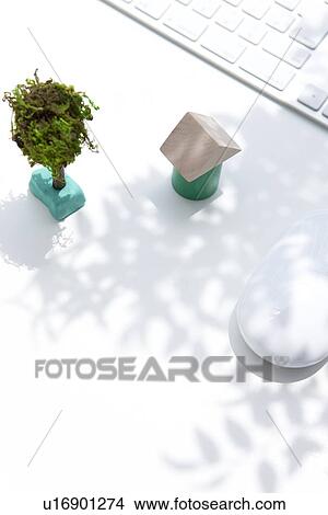 Picture - Wooden house, computer keyboard and mouse on white background. Fotosearch
