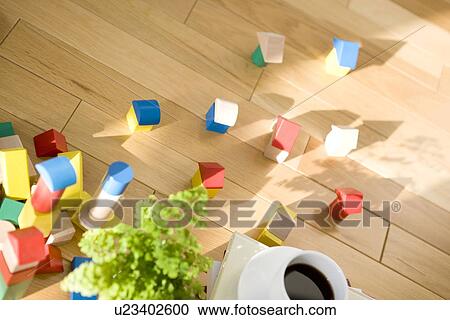 Wooden houses and cup of coffee on floor View Large Photo Image Stock Image - Wooden houses and cup of coffee on floor. Fotosearch