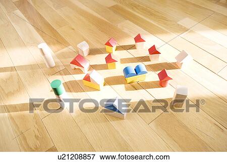 Stock Photo - Wooden houses on floor. Fotosearch