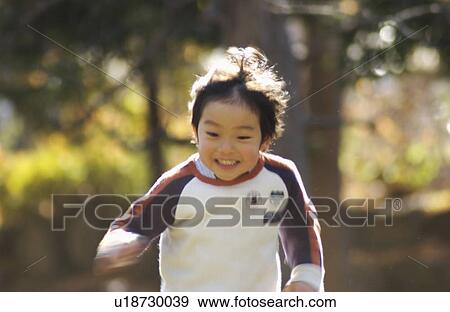 Young boy running, blurred motion, Tokyo Prefecture, Honshu, Japan View Large Photo Image Stock Photo - Young boy running, blurred motion, Tokyo Prefecture, Honshu, Japan. Fotosearch