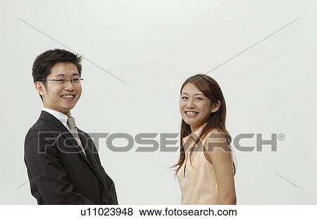 Stock Photo - Young Business Man and Woman. Fotosearch