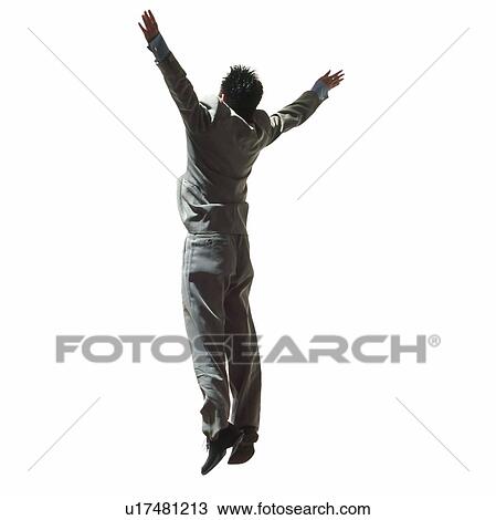 Stock Image - Young businessman jumping. Fotosearch