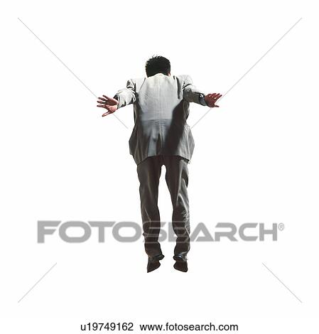 Stock Image - Young businessman jumping. Fotosearch
