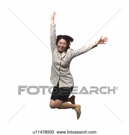 Stock Photography - Young businesswoman jumping. Fotosearch
