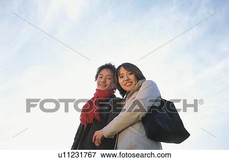 Young couple holding hands View Large Photo Image Stock Photo - Young couple holding hands. Fotosearch
